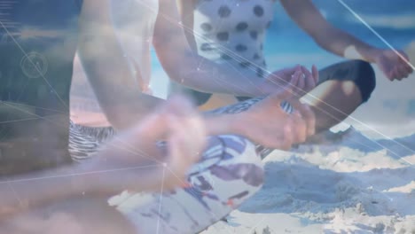 Animation-of-data-processing-over-group-of-female-friends-practicing-yoga,-meditating-at-the-beach