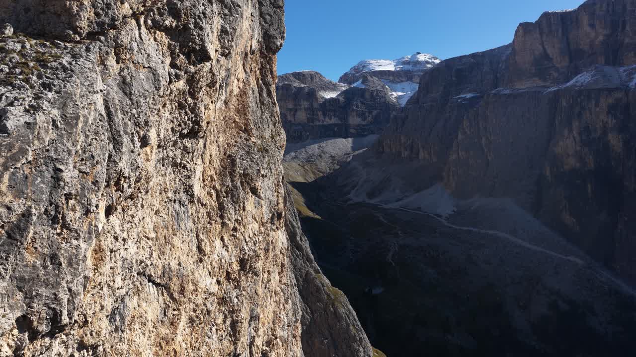 revealing aerial drone video over a mountain range in the Dolomites, Italy