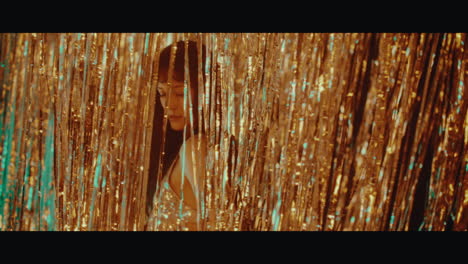 green glitter backdrop with person