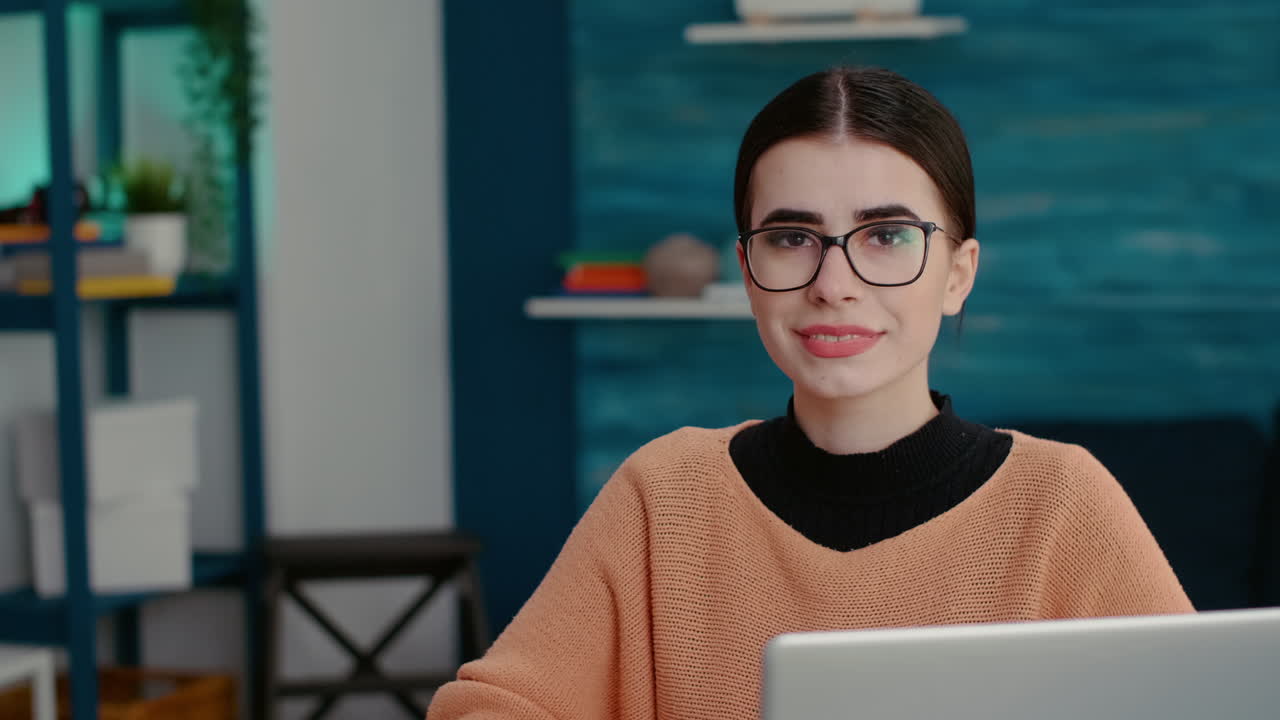 Mixed races of friends looking at tv, man holding remote control