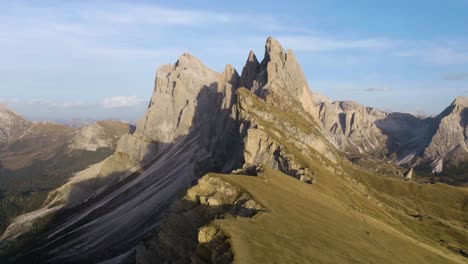 cinematic establishing shot above seceda mountain in italy's dolomites