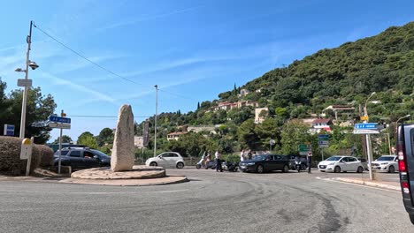 vehicles and pedestrians at a roundabout