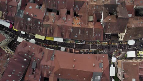 farmer's market in old town streets of annecy, france - vertical top down aerial