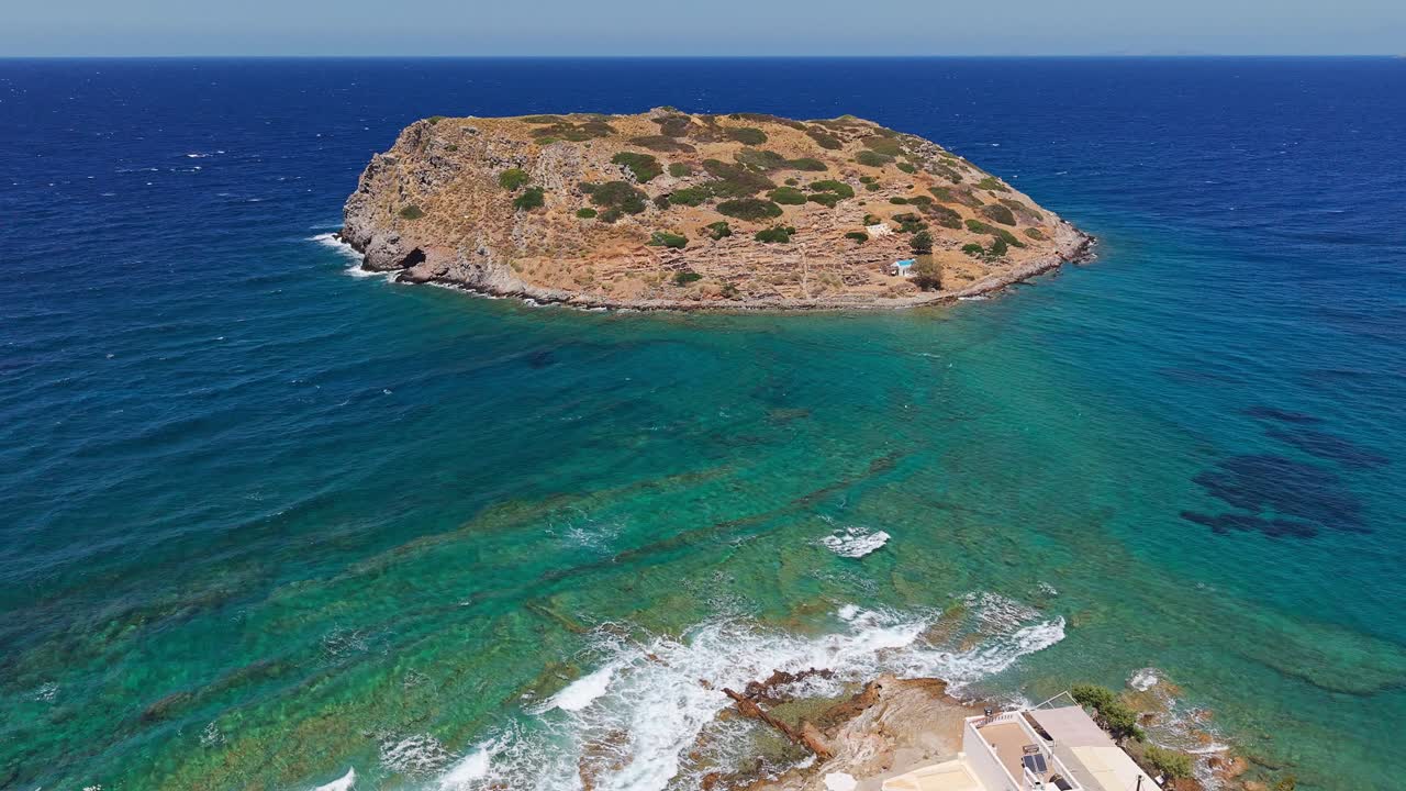 Aerial drone view of Mochlos village and island with Minoan ruins in Crete, Greece