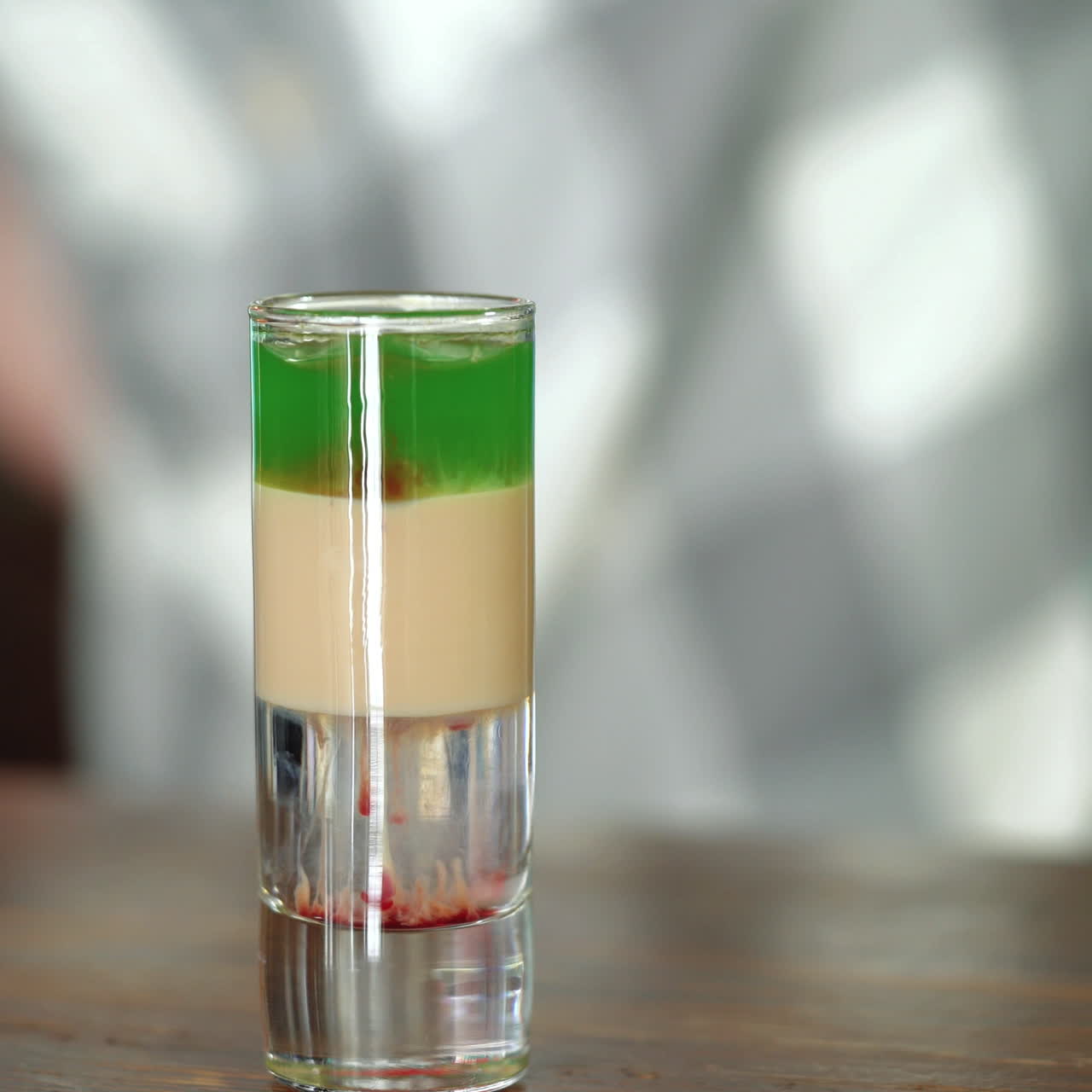 Barman makes a cocktail mixing three different liquids. Adding alcohol in short cocktail Sqare video