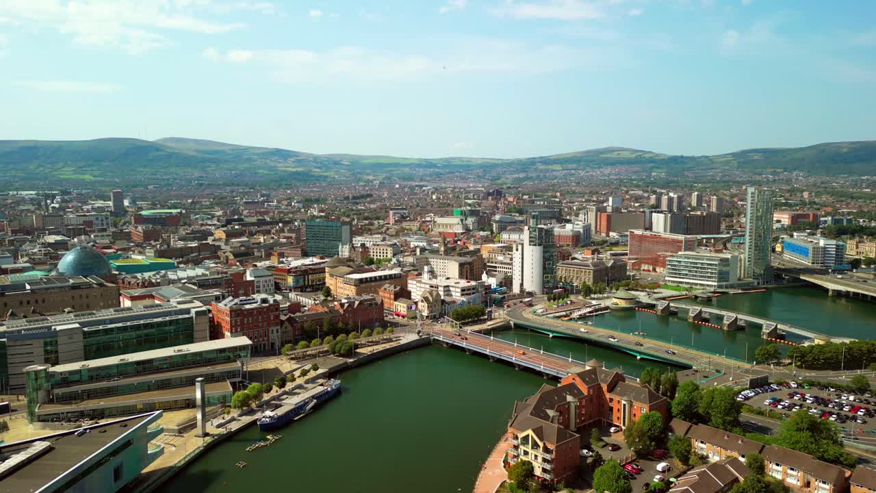 Front-on aerial GV of Belfast City Centre, Northern Ireland, UK on a bright and sunny day. Produced in 4K, 60FPS and with Rec709 color