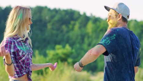 Cheerful-Attractive-Hipster-Guy-Dancing-With-His-Charming-Blond-Girlfriend-And-Laughing