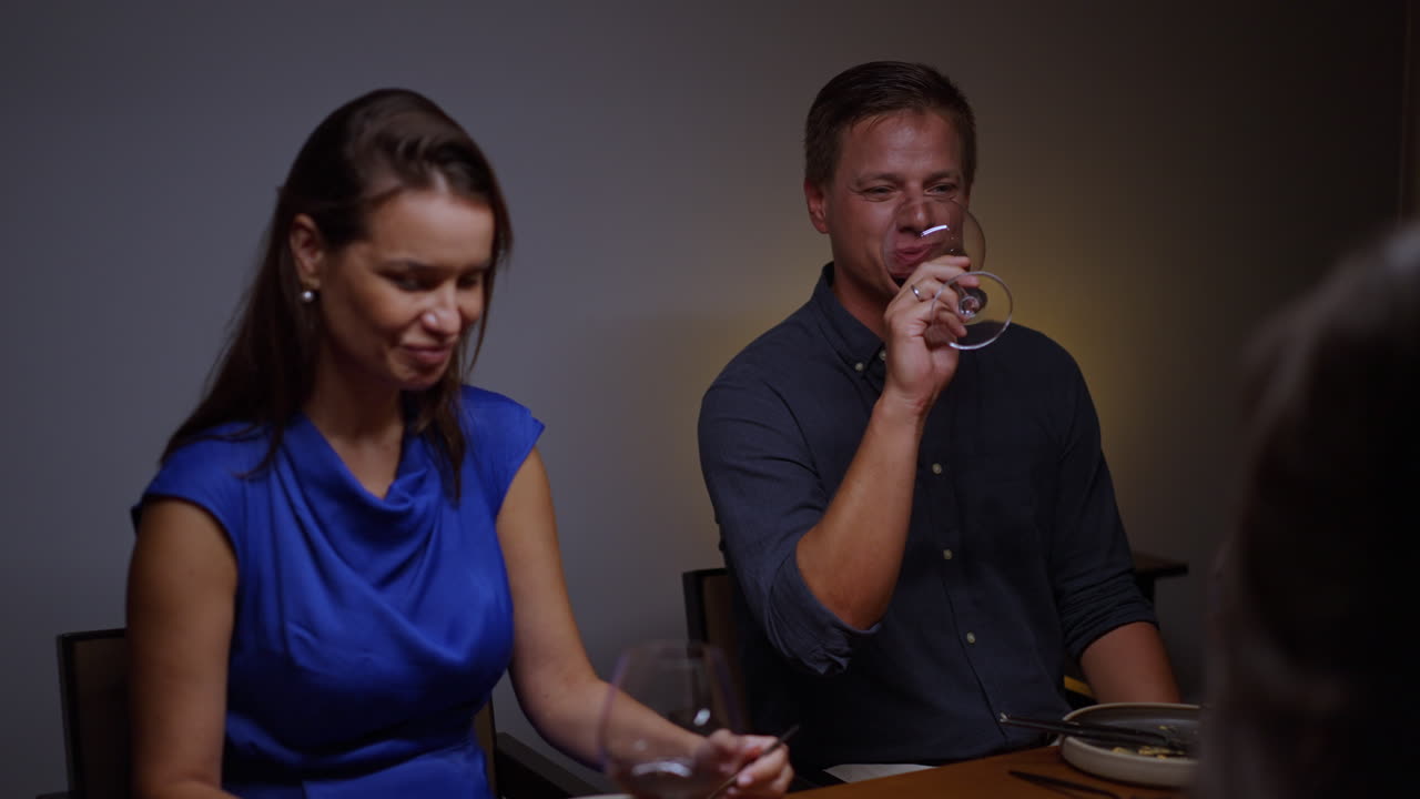 People having dinner with wine
