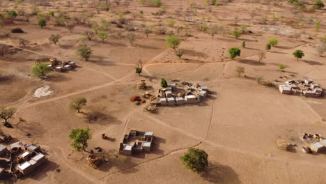 Drone-takes-aerial-view-of-village-in-Burkina-Faso,-Africa