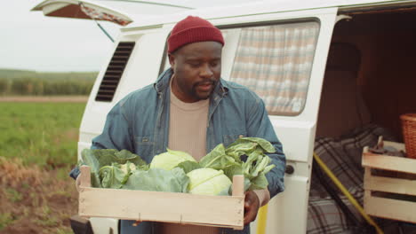 Multiethnic Man and Woman Preparing Farm Vegetables for Sale