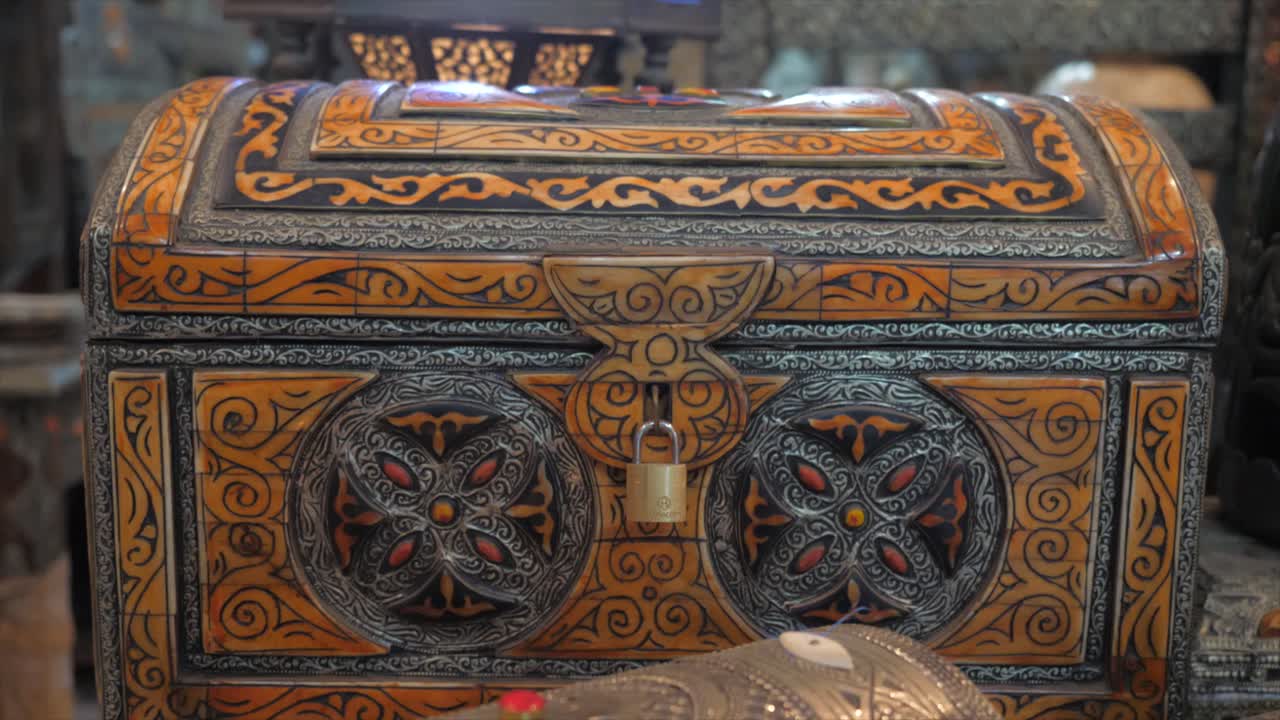 Ancient bronze treasure chest and lamp kept in an middle east antique shop.