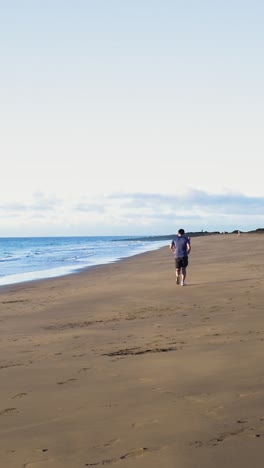 people running on a beach