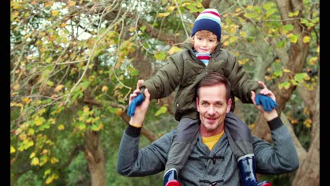 Father-and-son-in-the-countryside-on-autumn-day