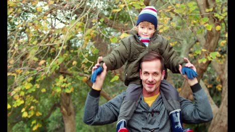 father and son in the countryside on autumn day