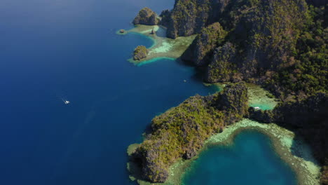 Aerial-view-Coron-Island-with-spider-boats-travelling,-Palawan,-Philippines