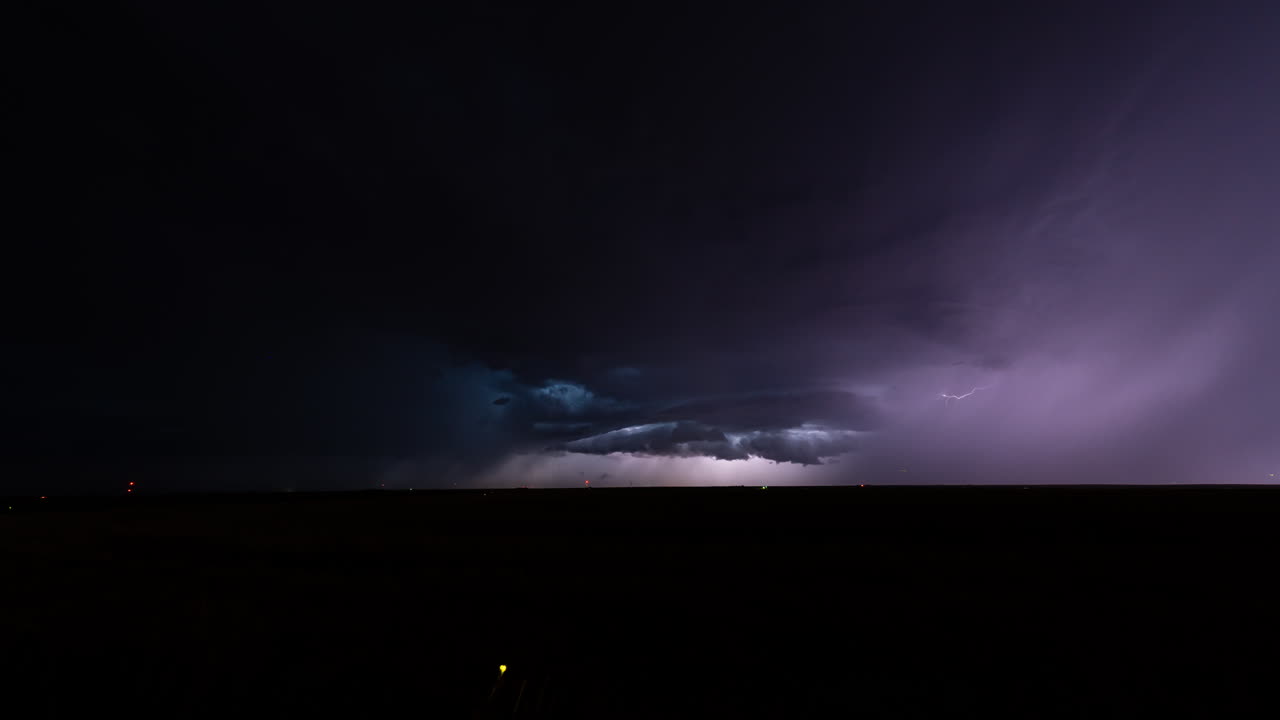 Powerful electric storm fills the night sky with lightning flashes