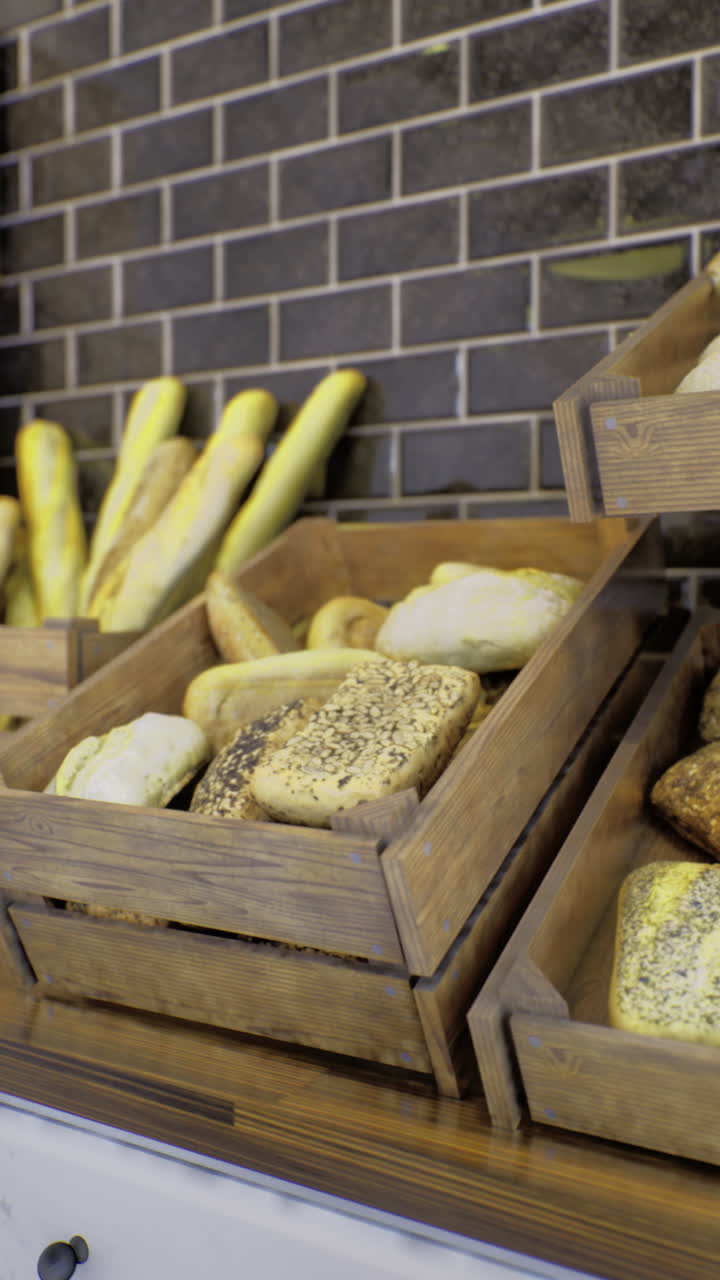 Freshly baked bread displayed in rustic wooden crates at a cozy bakery