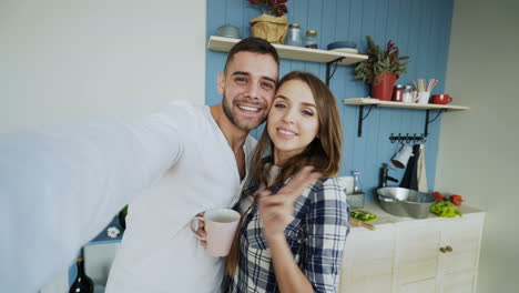 couple taking a selfie in kitchen