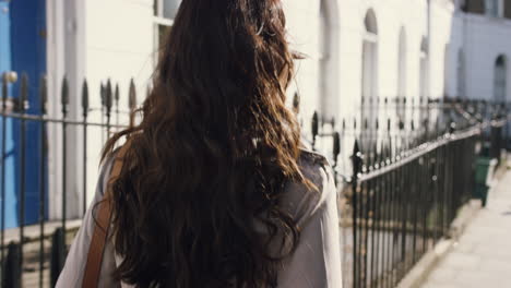 beautiful indian woman walking through city