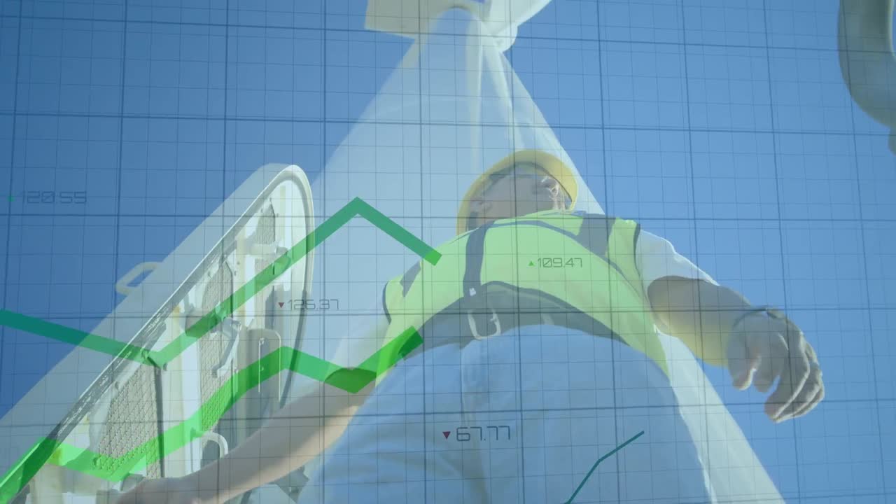 풍차 근처에 서 있는 남성 건축가의 낮은 각도 뷰를 통해 움직이는 녹색 그래프의 애니메이션