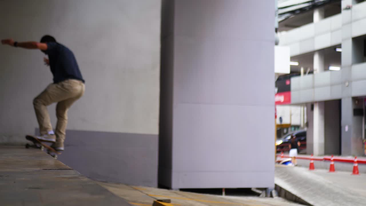 Man does a trick on his skateboard in Thailand