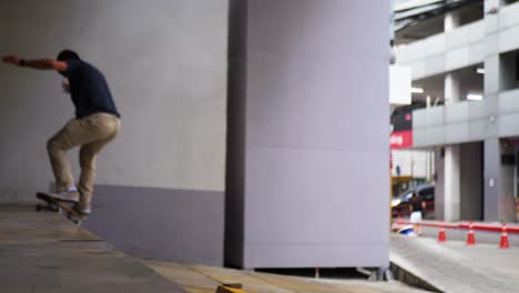 man does a trick on his skateboard in thailand