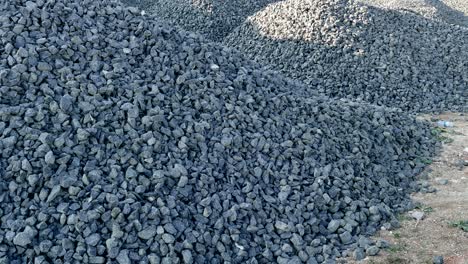 large pebbles laid on railway tracks, speed railway, small pieces of rock used in construction,