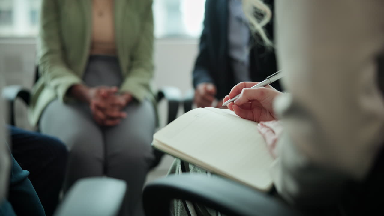Business meeting with writing in a notebook