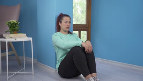 Depressed-woman.-It-sits-by-the-wall.