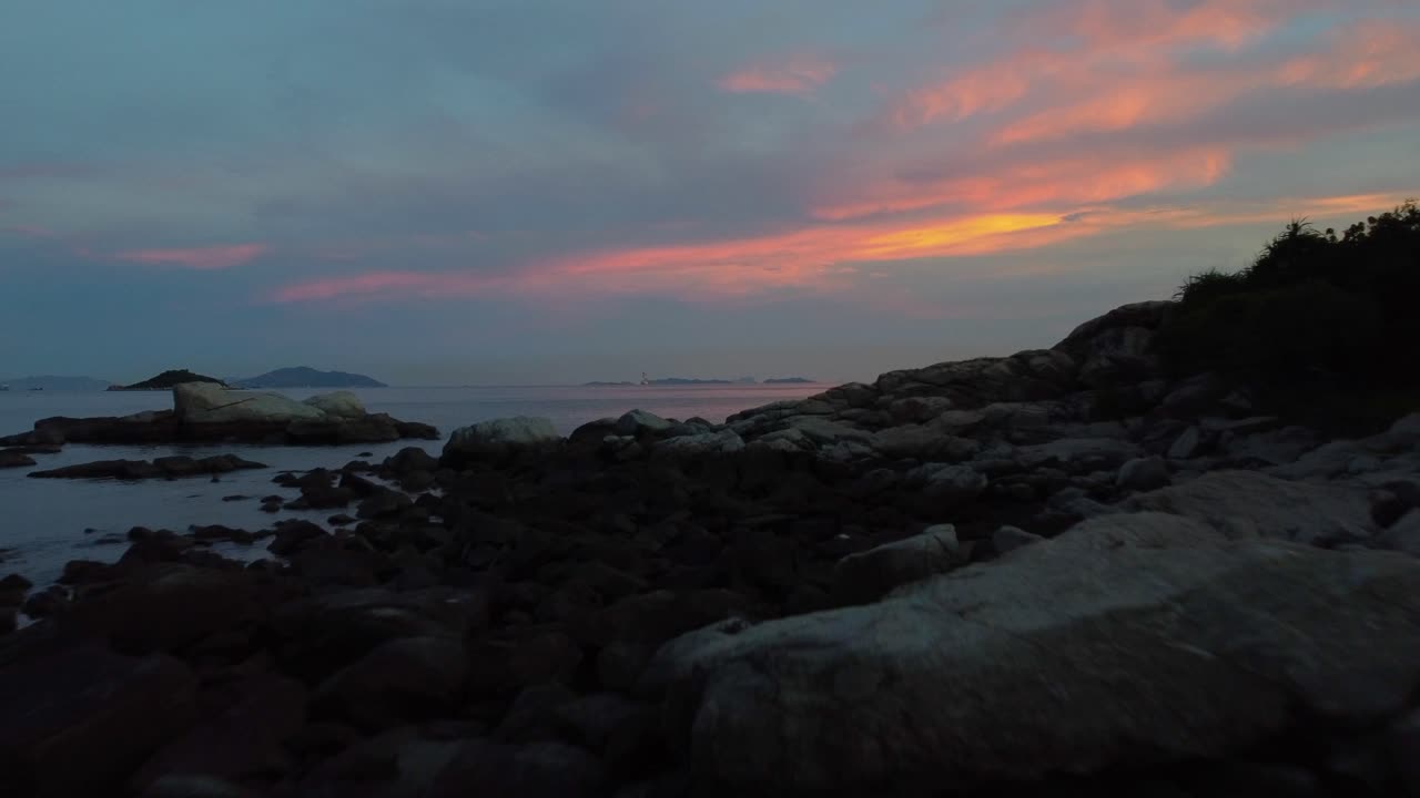 Late Evening Drone Shot Over over a Beach Rocks and Sea in Hong Kong
