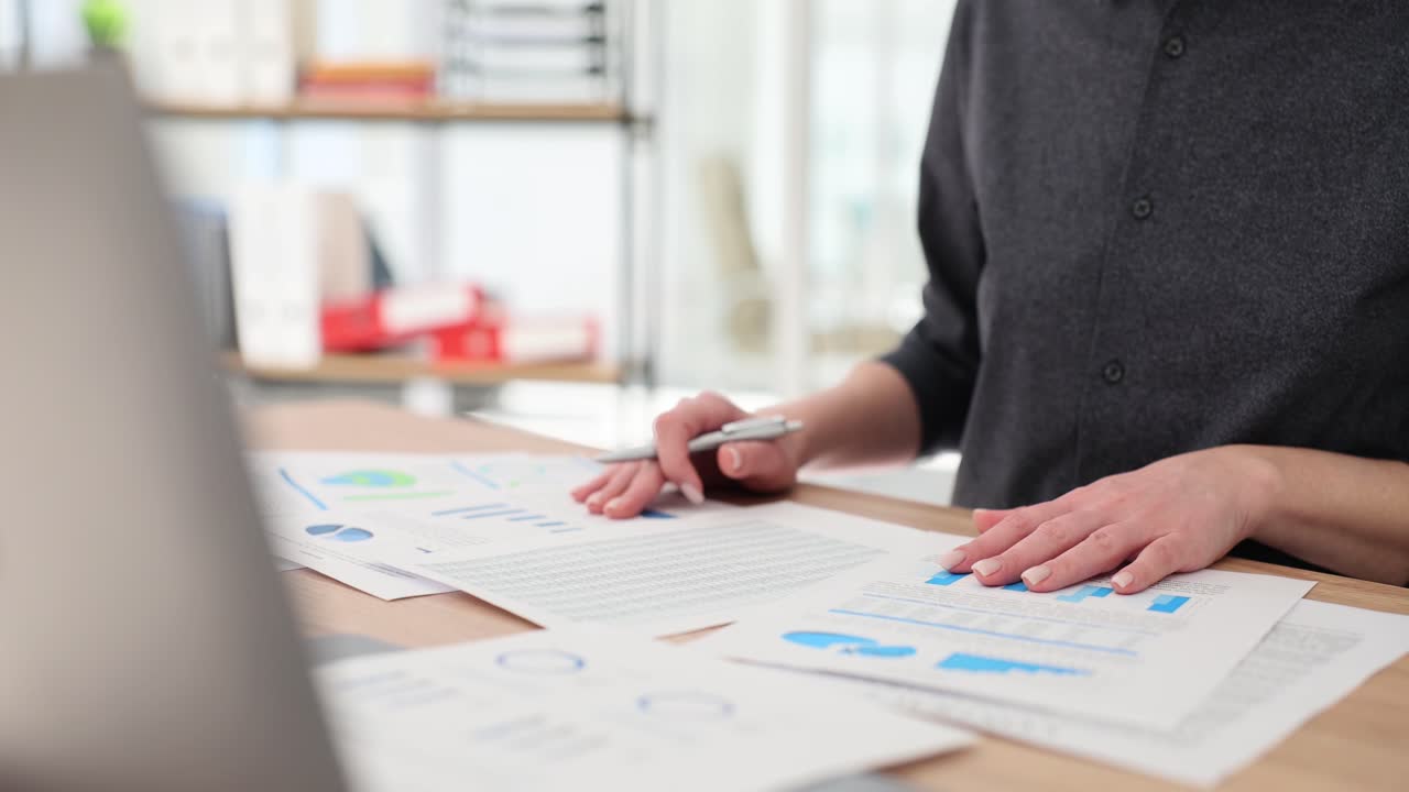 Businesswoman Analyzing Data Reports