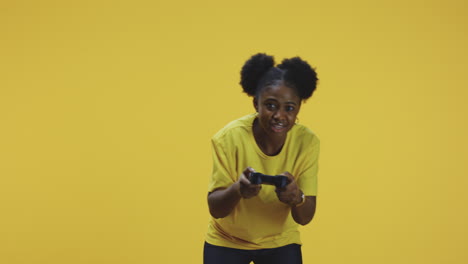 a young woman playing a video game with a controller on a yellow background