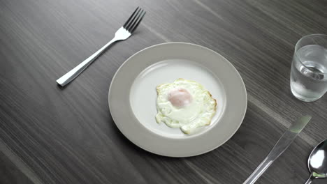 place the bread on a plate that has eggs