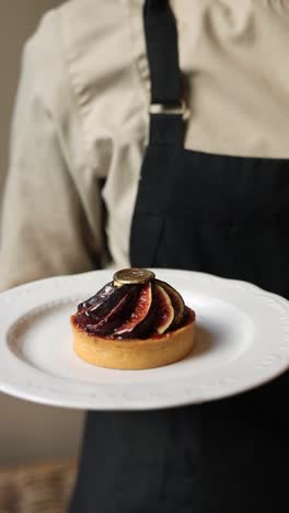 chef presenting a delicious fig tart