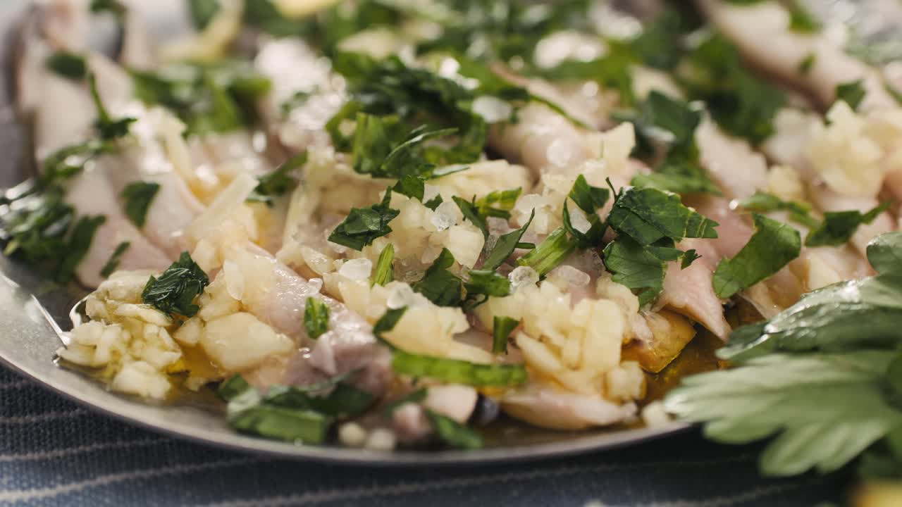 Fresh Sea sardines and Anchovy Fish and Mullus On Display On Ice On Market Store Shop. Seafood Fish Background, close up stand of small salty white fish.