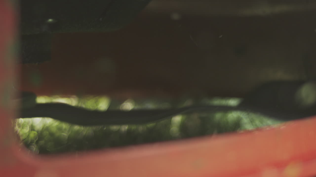 Close-up of a blurred vehicle undercarriage