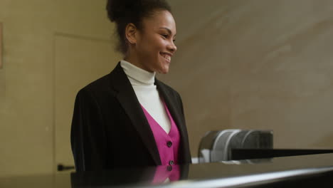 receptionist helping a guest check in