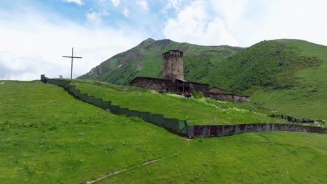 medieval georgian orthodox church of lamaria in ushguli, upper svaneti region, georgia. aerial drone shot
