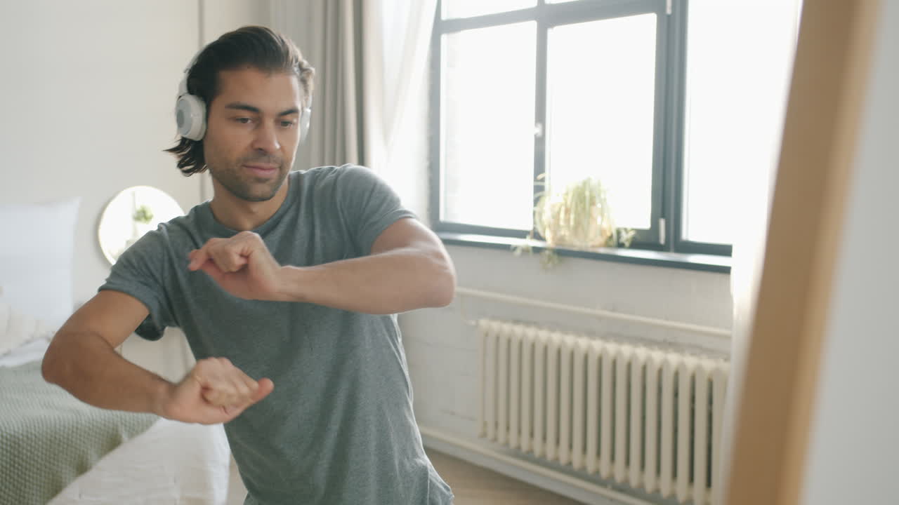 Man Dancing in His Bedroom