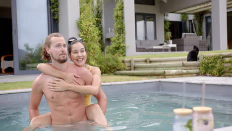 A-young-Caucasian-couple-enjoys-a-pool-day-at-home