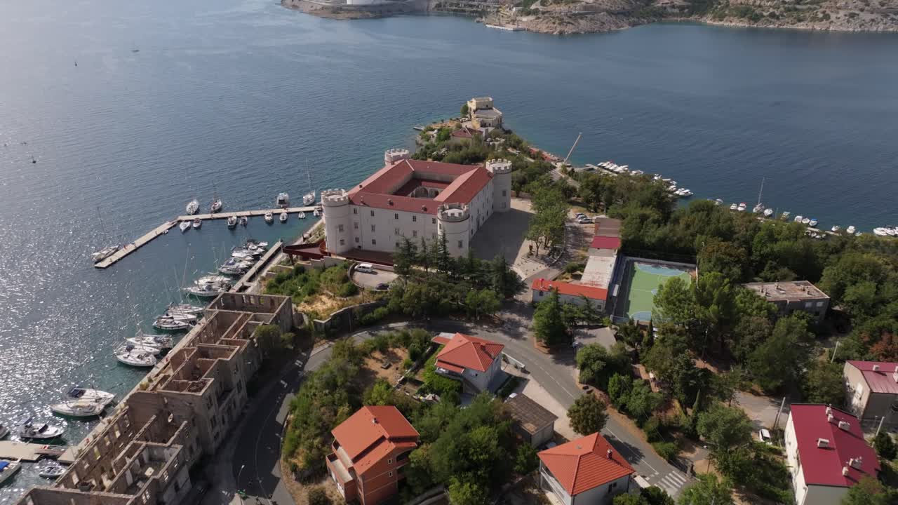 Aerial View of a Coastal Town with a Castle and Refinery