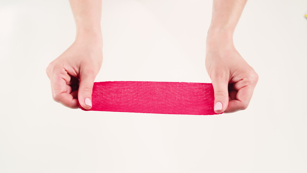 Kinesiology medical taping, doctor Physical therapist applying elastic surgical tape to patient body, treating injured knee young athlete.Post traumatic rehabilitation, sport physical therapy recovery