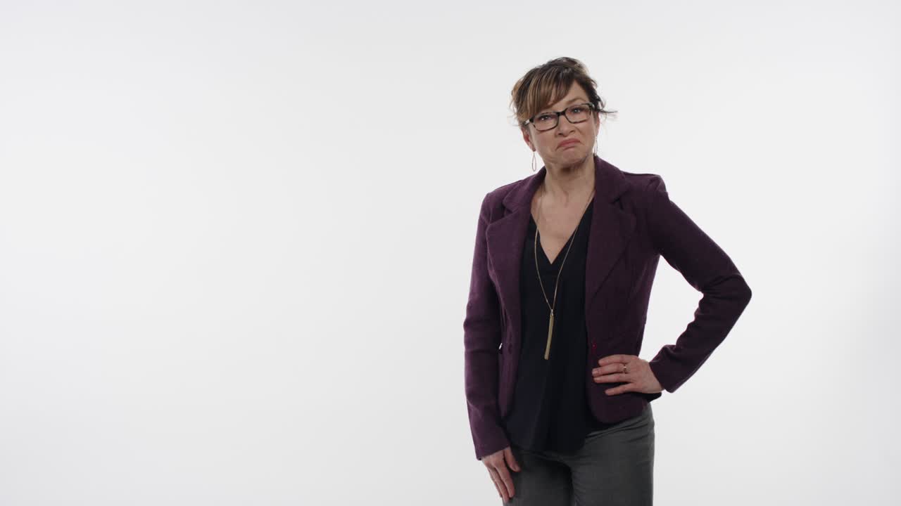 Middle aged businesswoman reacts to a graphic that makes sense