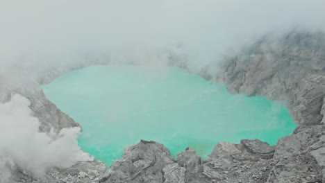 ijen volcano with the turquoise-coloured acidic crater lake