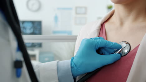 doctor examining patient's heart