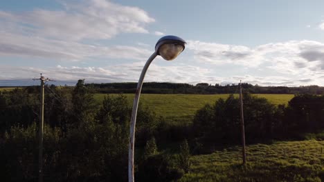 rusty street light at highway circled