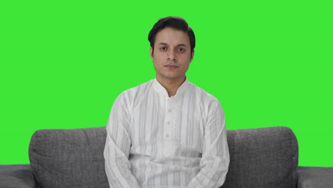 indian man looking at the camera green screen