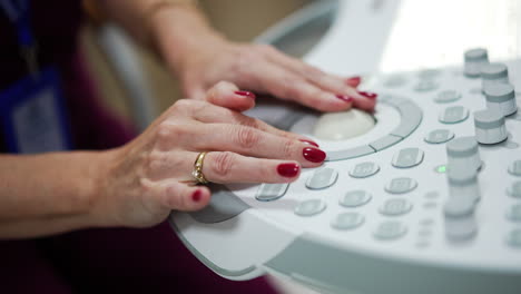 ultrasound technician operating a machine