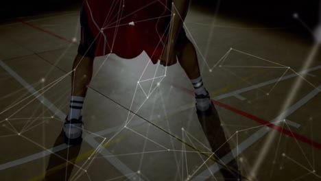 animation of networks of connections over mixed race male basketball player at gym