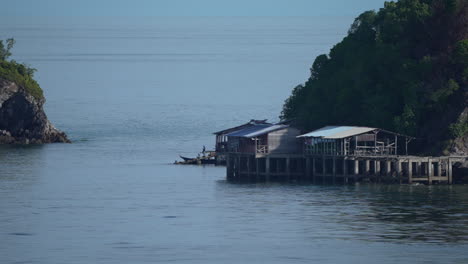 fishing village floating on sea at the age of mountain